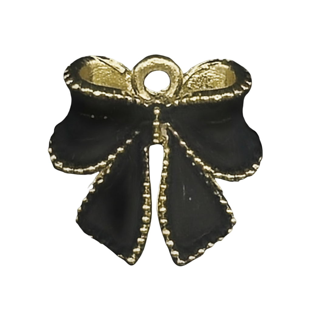 close-up of a black bow charm with gold edging on a black background