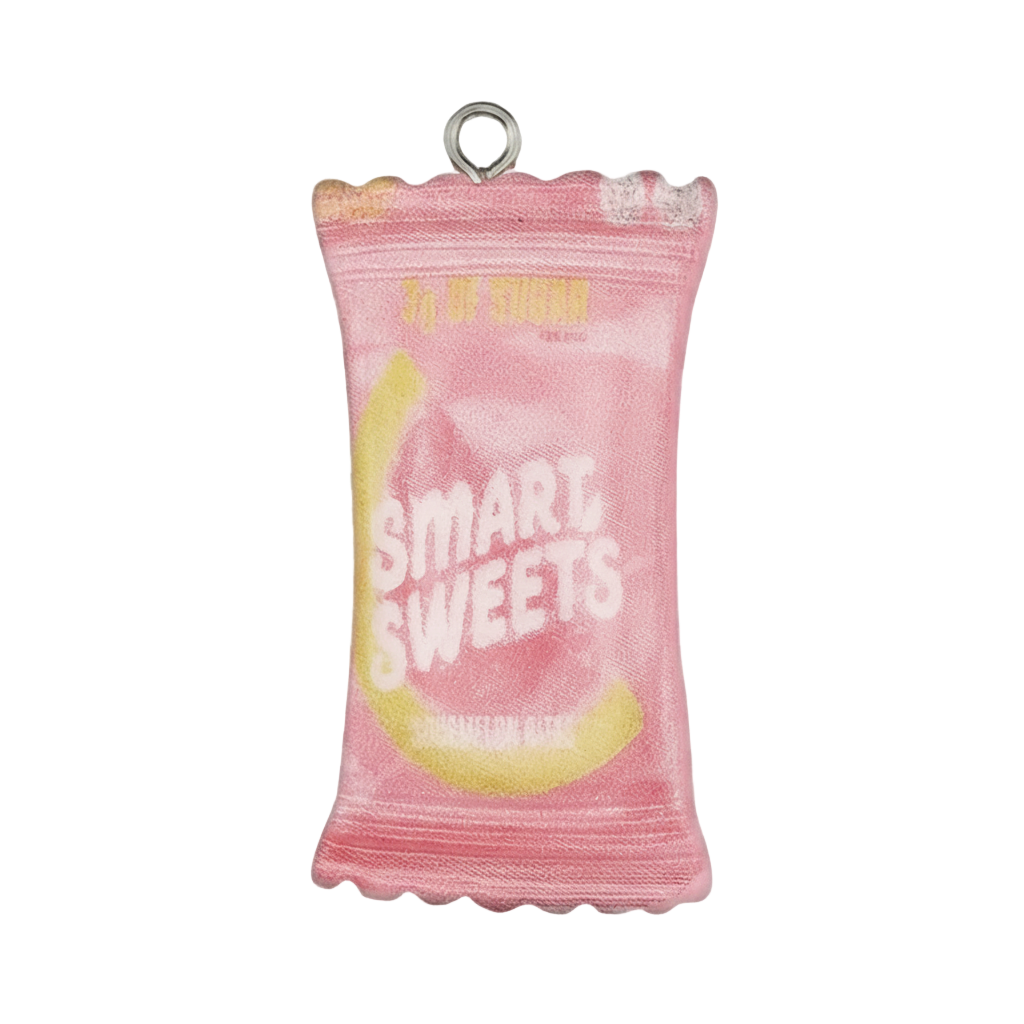 close-up of a pink candy bag charm with 'SMART SWEETS' text on a black background
