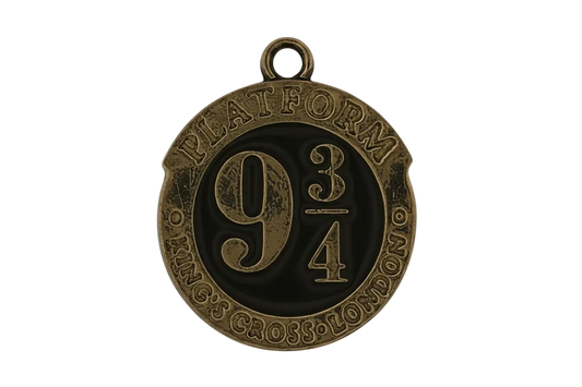 close-up of a round bronze charm reading "Platform 9 3/4" with black background