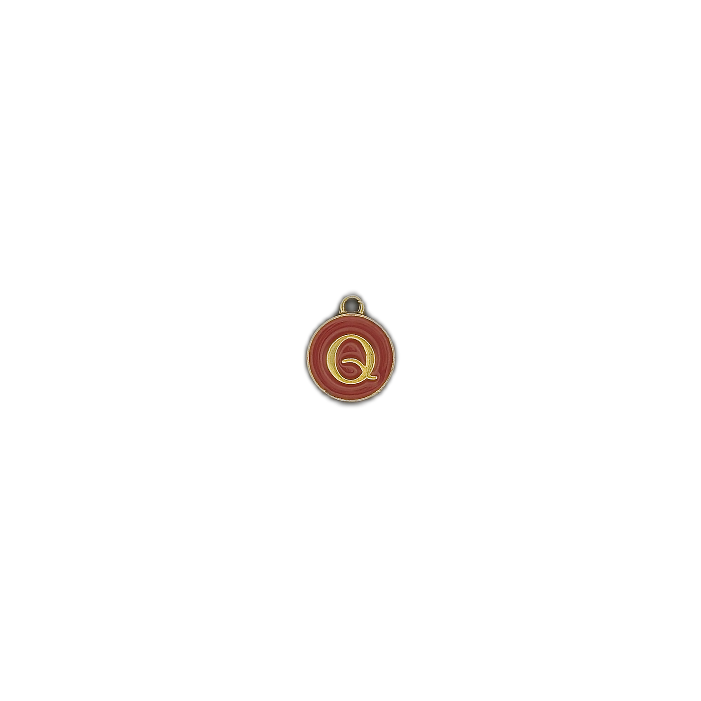 round red charm with a gold letter Q centered on a black background