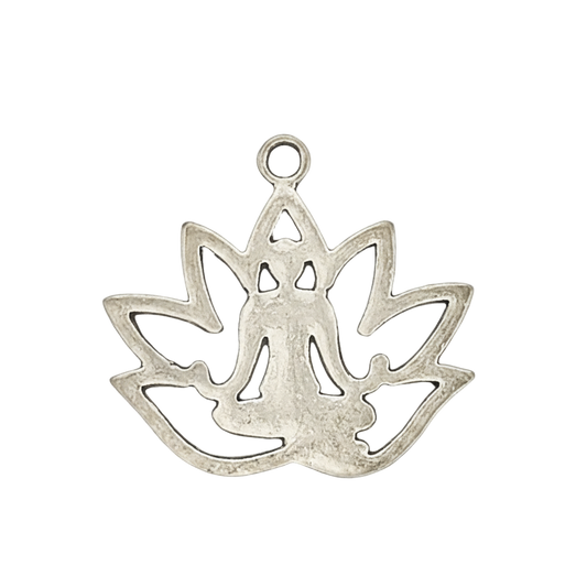 close-up of silver charm showing a meditating figure inside a lotus shape on black background