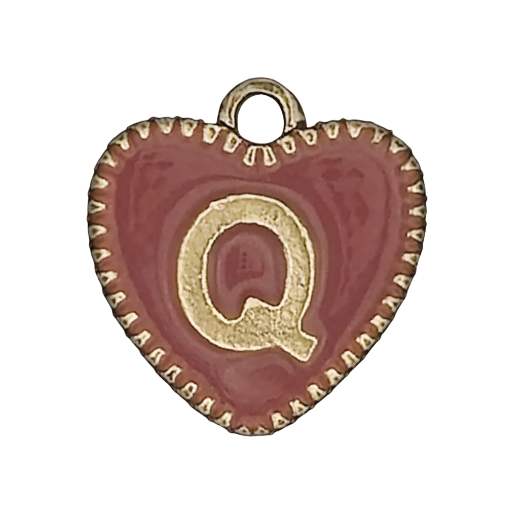 close-up of red heart charm with gold letter Q