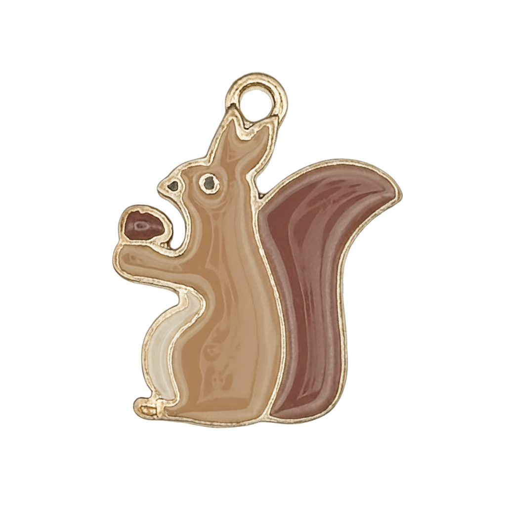 close-up of brown enamel squirrel charm holding an acorn on black background