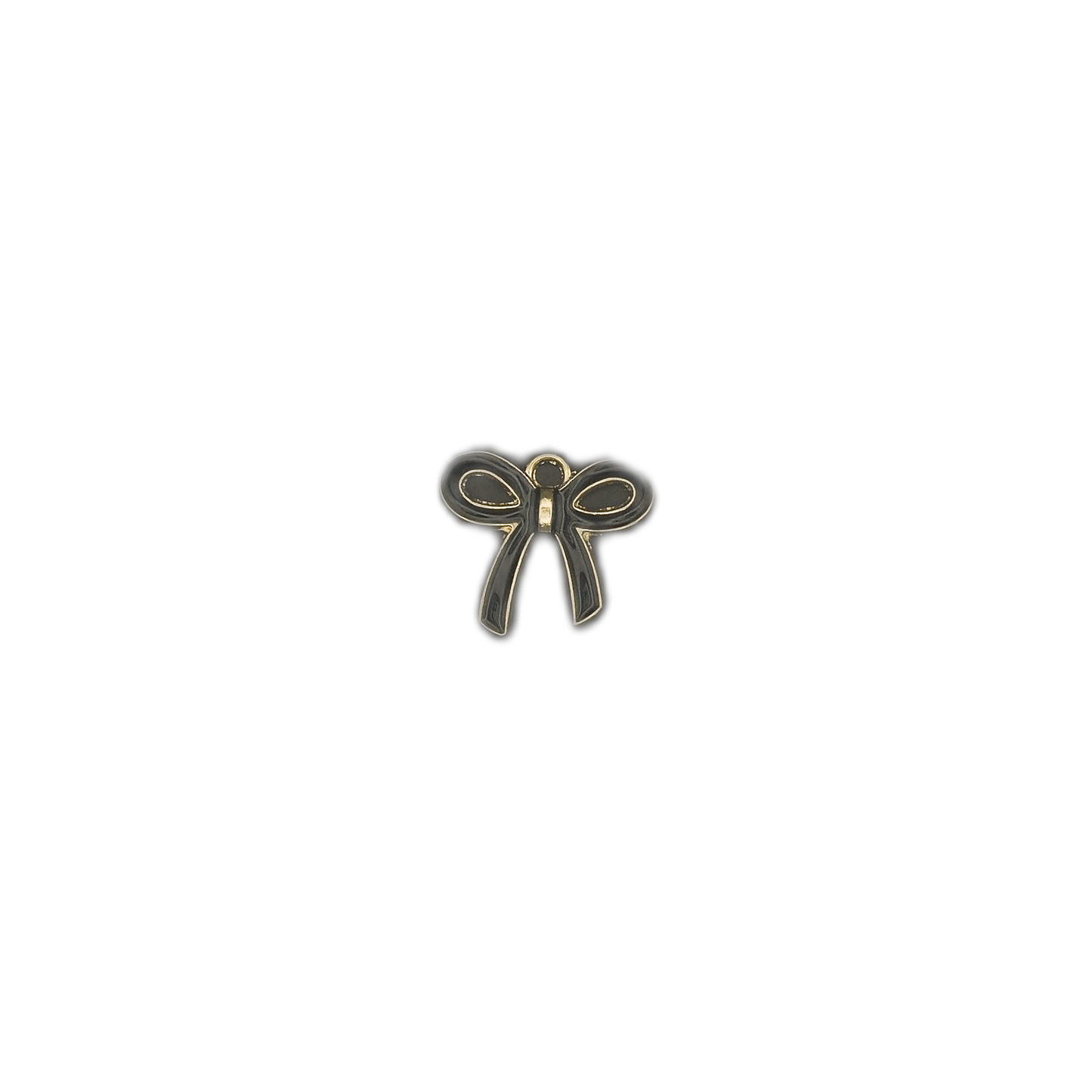 small black and gold bow charm centered on a black background