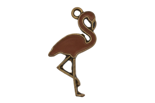 close-up of a pink enamel flamingo charm with gold outline, one leg raised