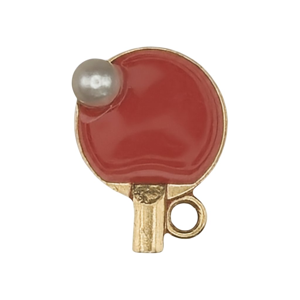 gold-tone red table tennis paddle charm with small white ball, close-up