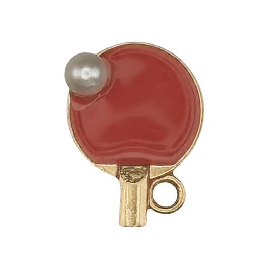 gold-tone red table tennis paddle charm with small white ball, close-up