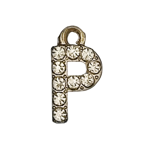 close-up of gold-tone letter P charm with clear crystals