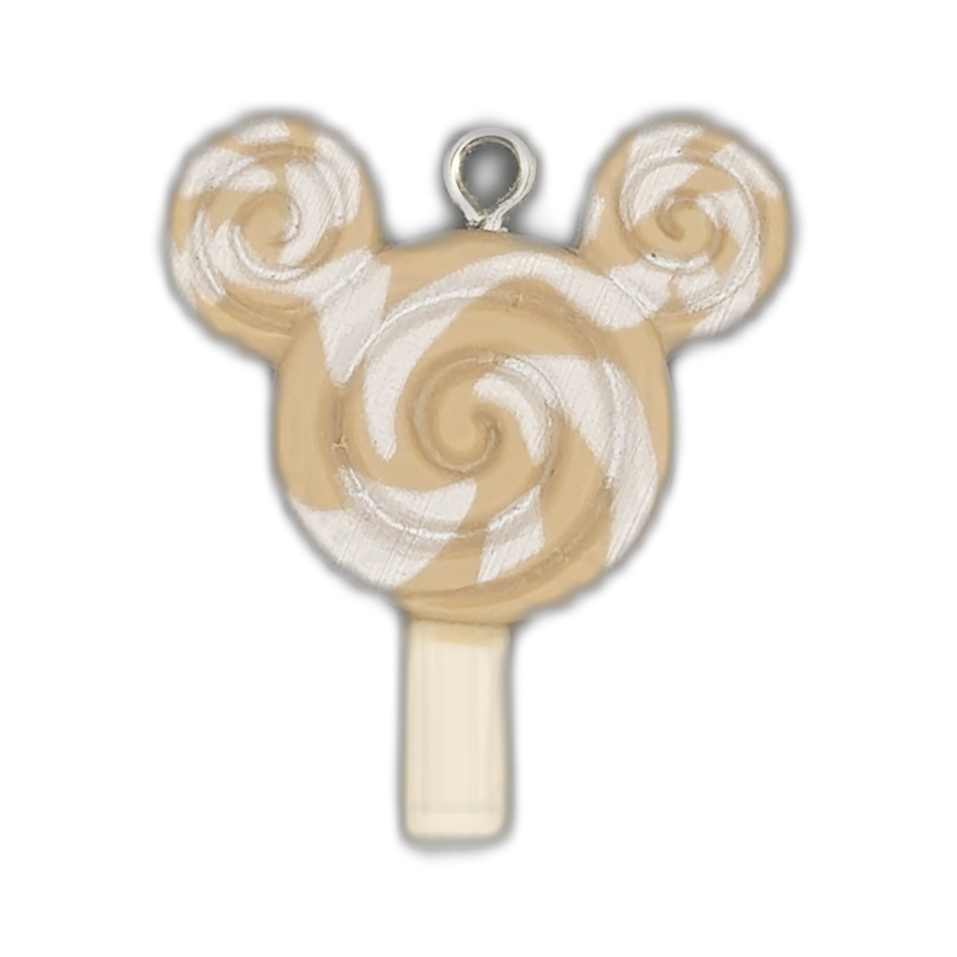 close-up of beige and white swirled lollipop charm shaped like a mouse head on a black background