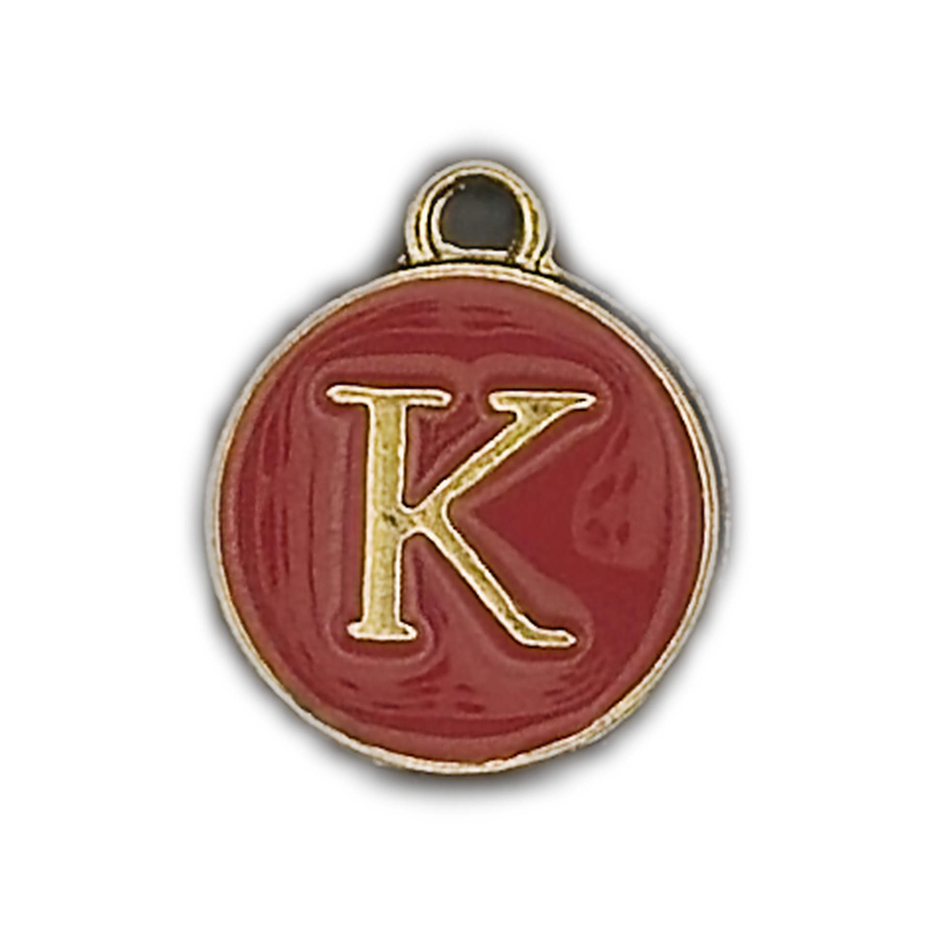 Close-up of a round red charm with a gold letter K on a black background.
