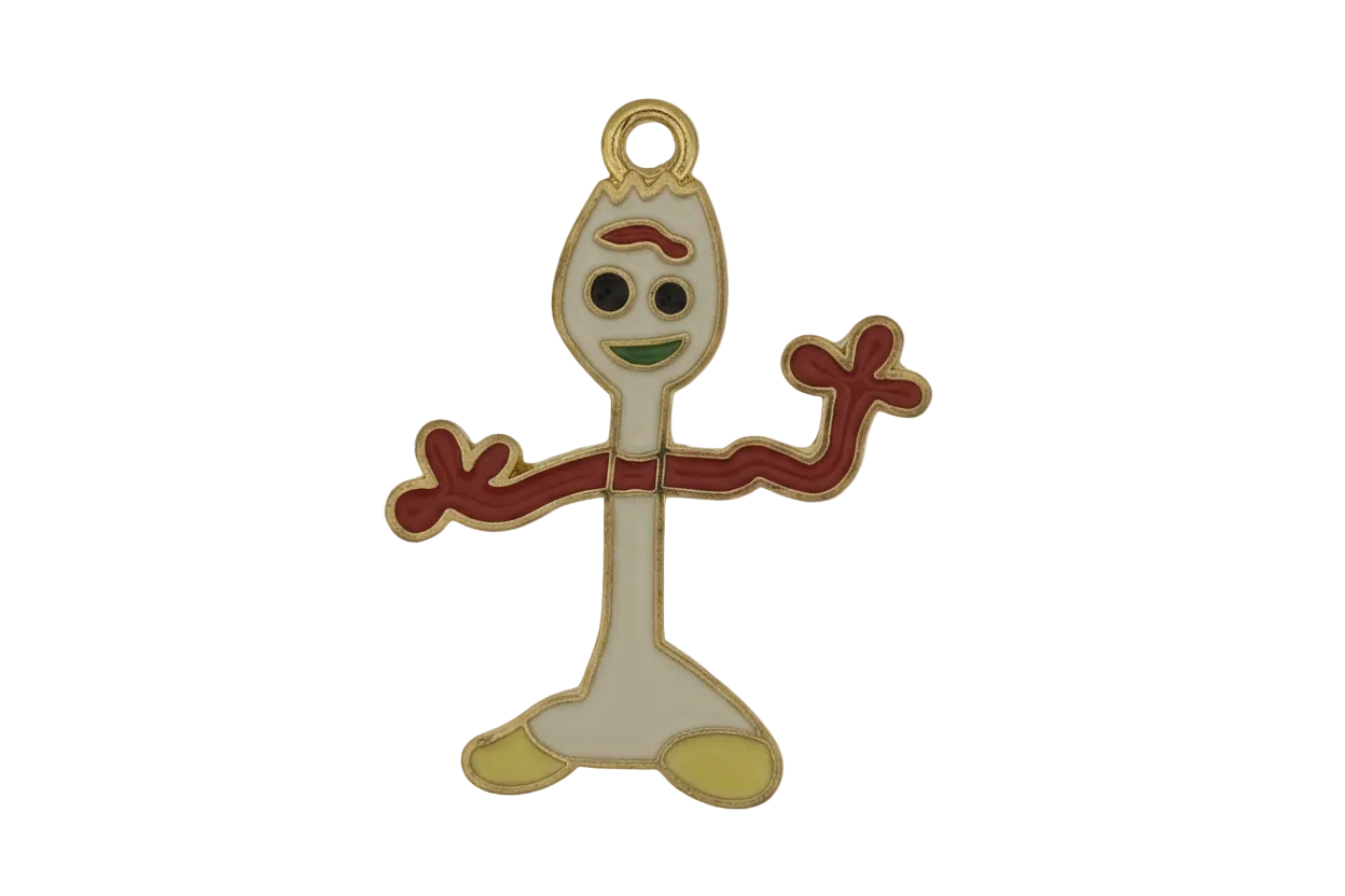 close-up of enamel spork character charm on black background
