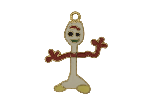 close-up of enamel spork character charm on black background