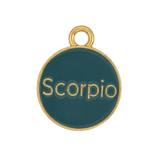close-up of a round teal enamel charm with gold edge and the word Scorpio