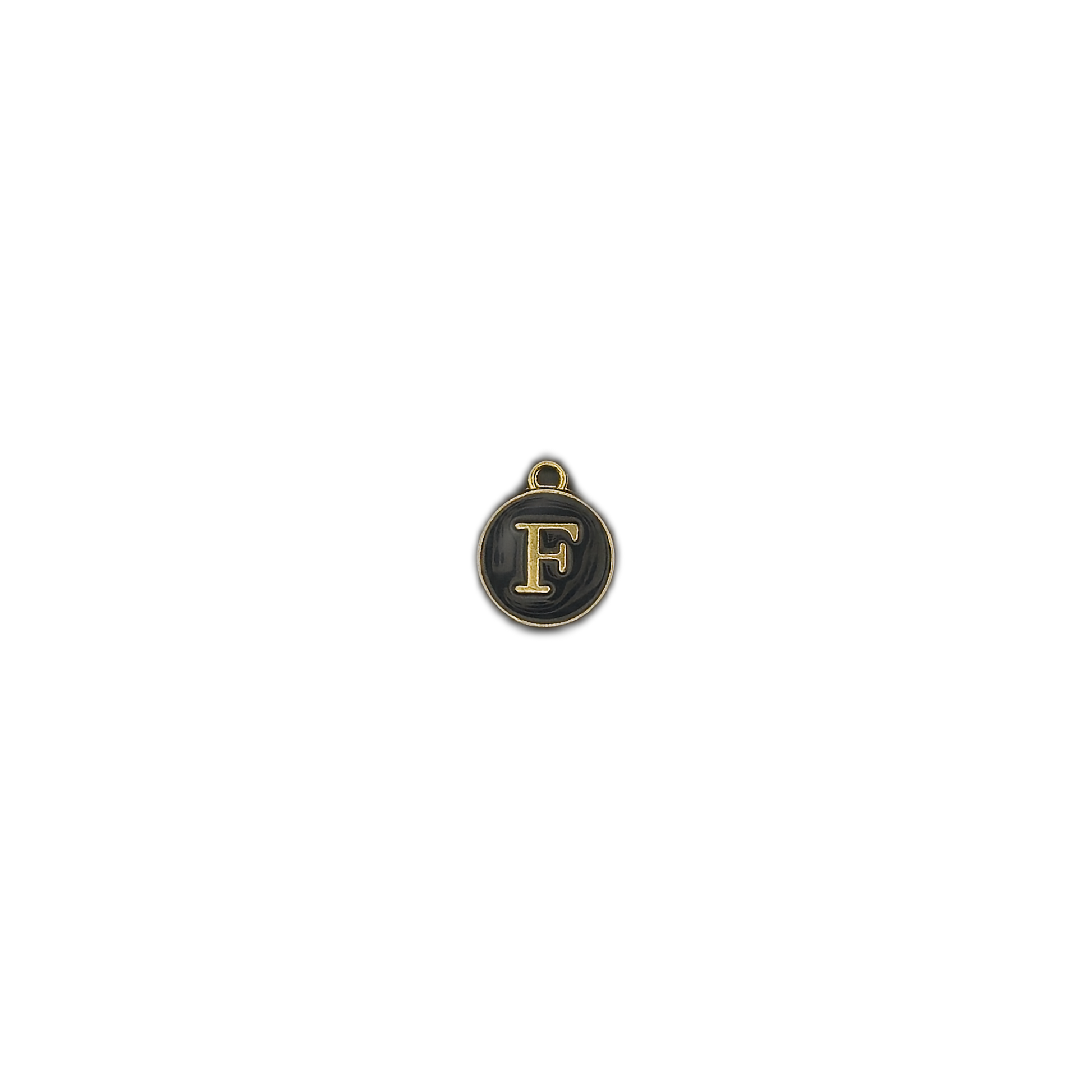 small round black and gold letter F charm centered on a black background