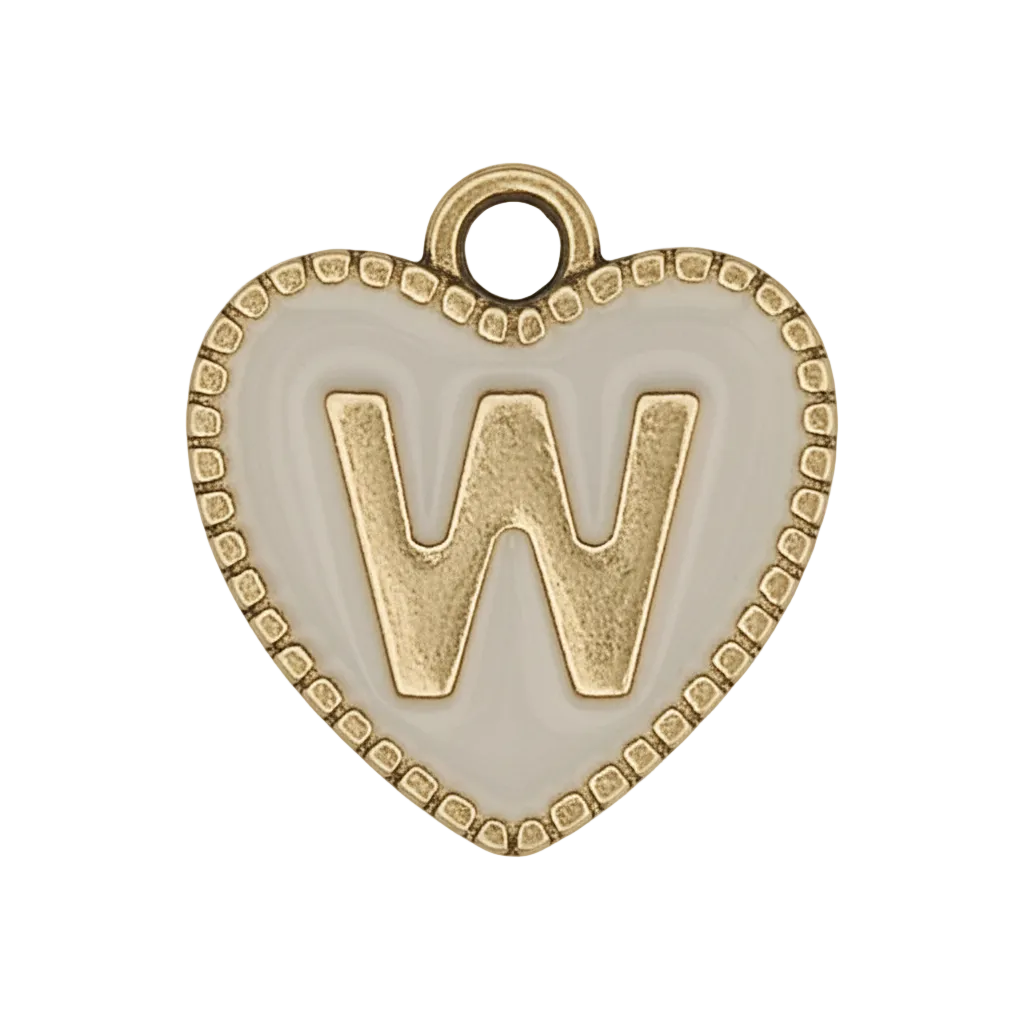 close-up of a white heart charm with a raised gold letter W