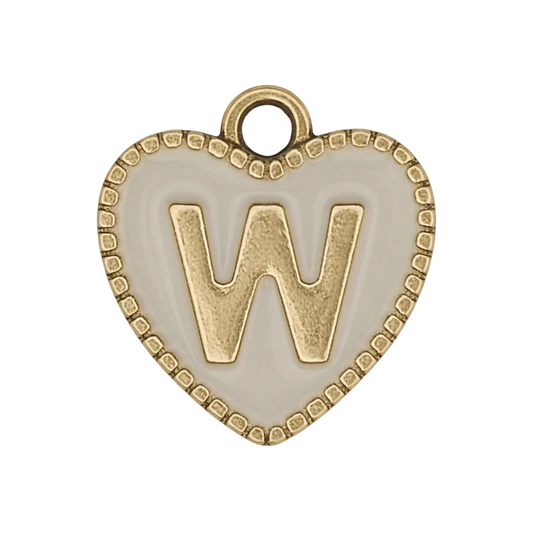close-up of a white heart charm with a raised gold letter W