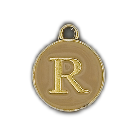close-up of round gold-tone letter R initial charm with beige enamel center