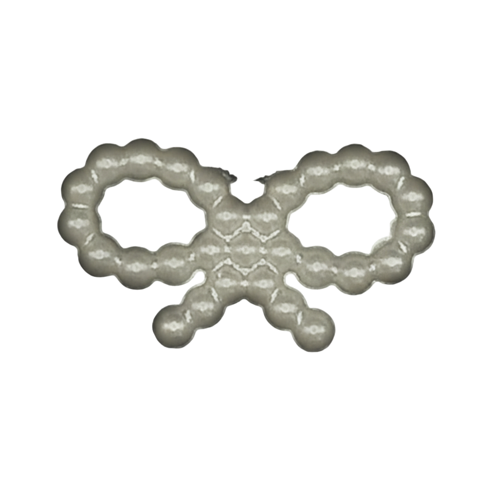 close-up of small pearl beaded bow charm on black background