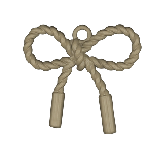 close-up of a gold-tone rope bow charm