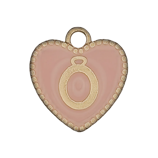 close-up of pink heart charm with gold letter O