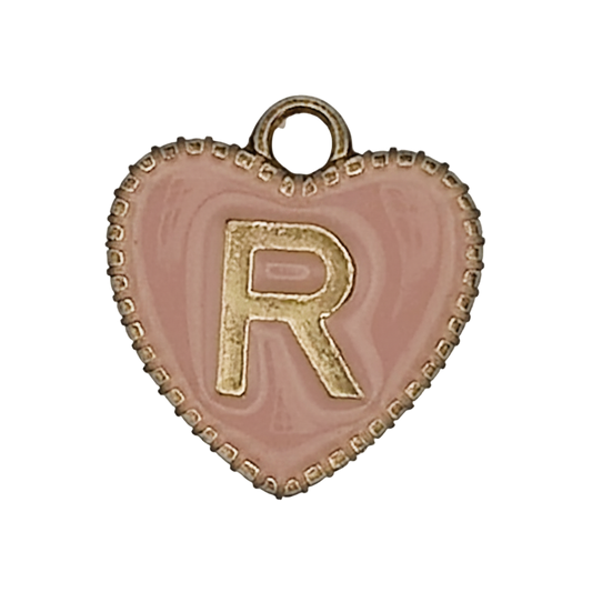 close-up of pink heart charm with gold letter R