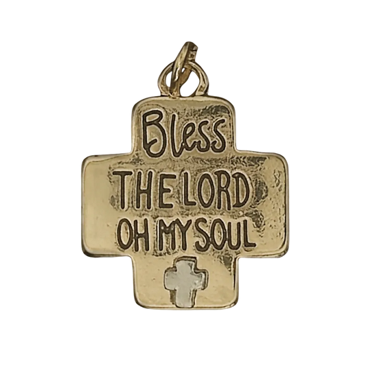 close-up of gold cross-shaped charm reading 'Bless the Lord Oh My Soul' with small cross detail on black background
