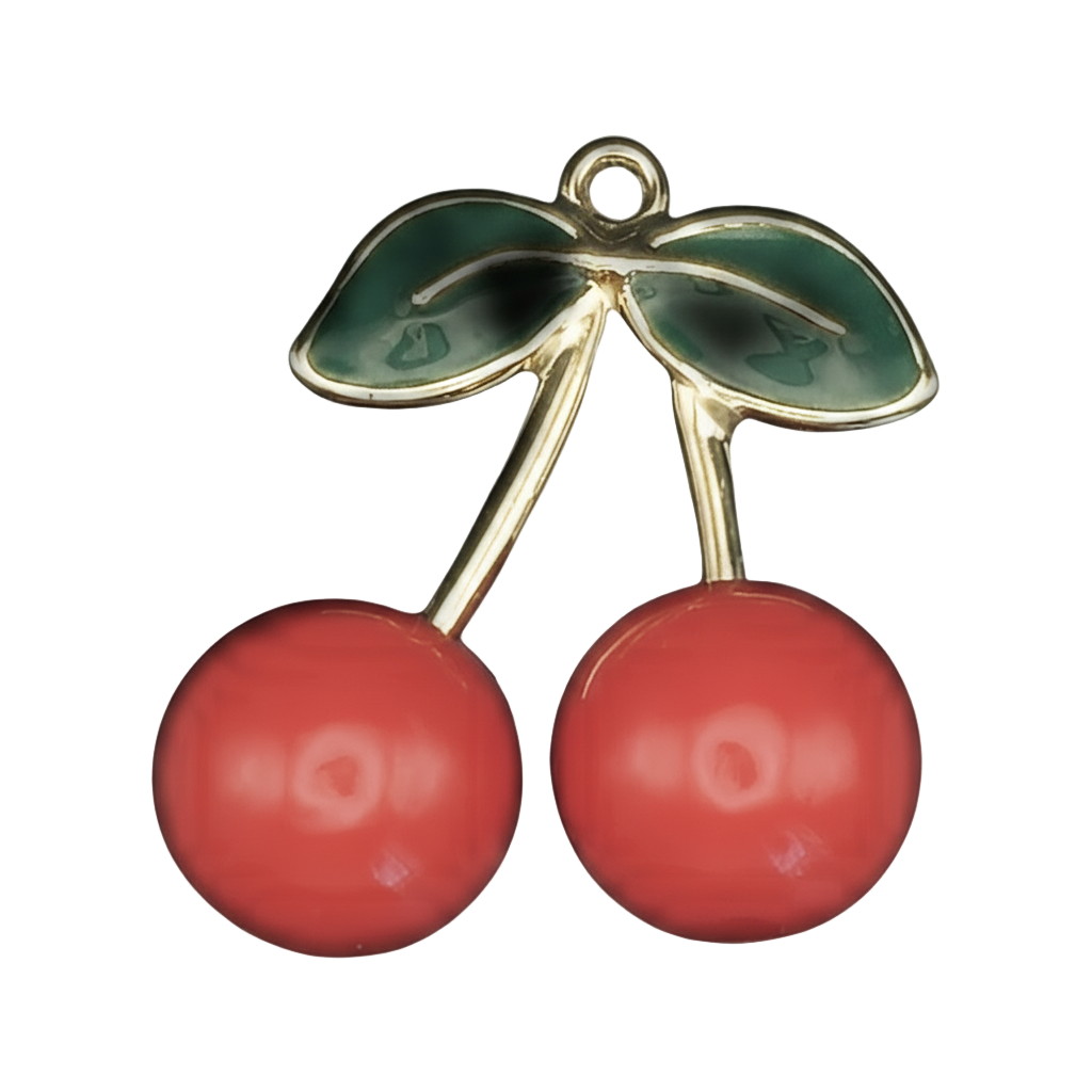 gold-tone cherry charm with two red cherries and green leaves on a black background