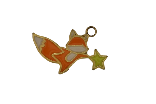 orange fox enamel charm holding a green star on black background