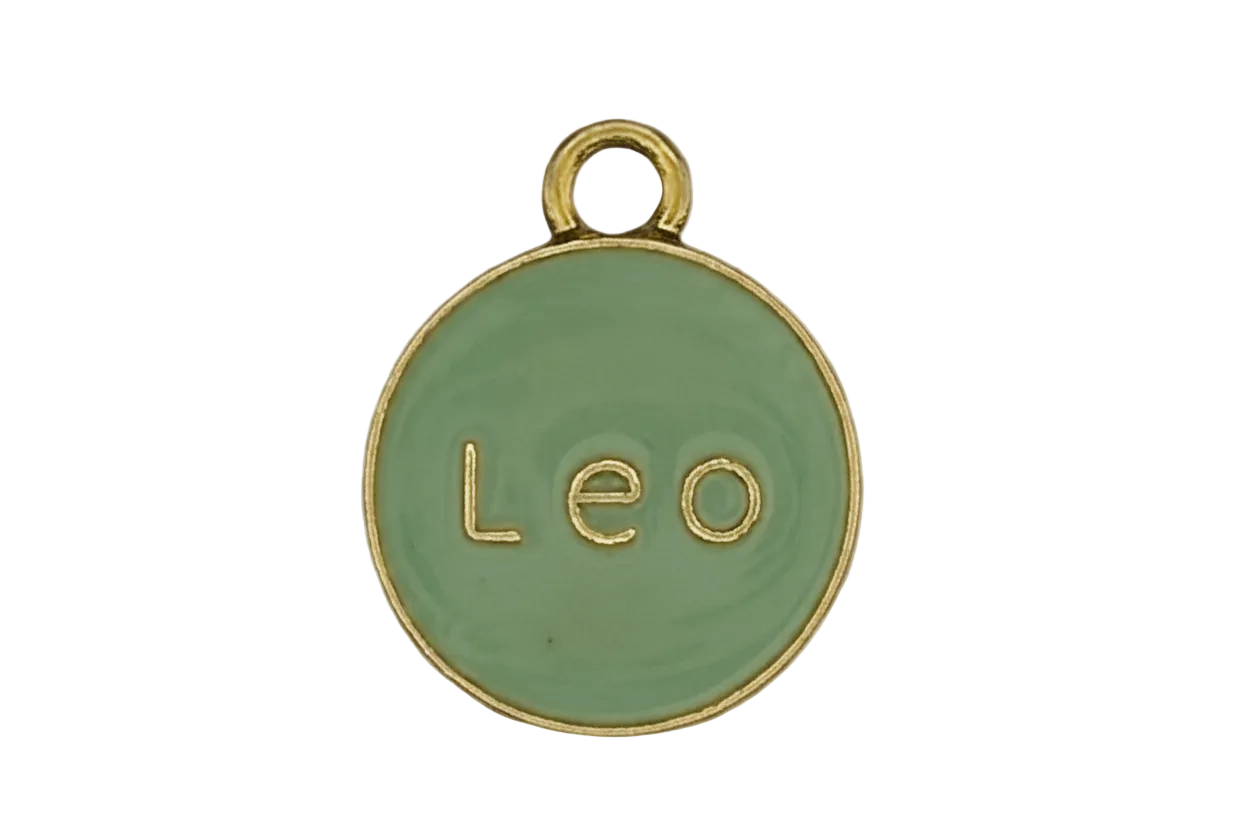 Close-up of round mint enamel charm with gold 'Leo' text and rim.
