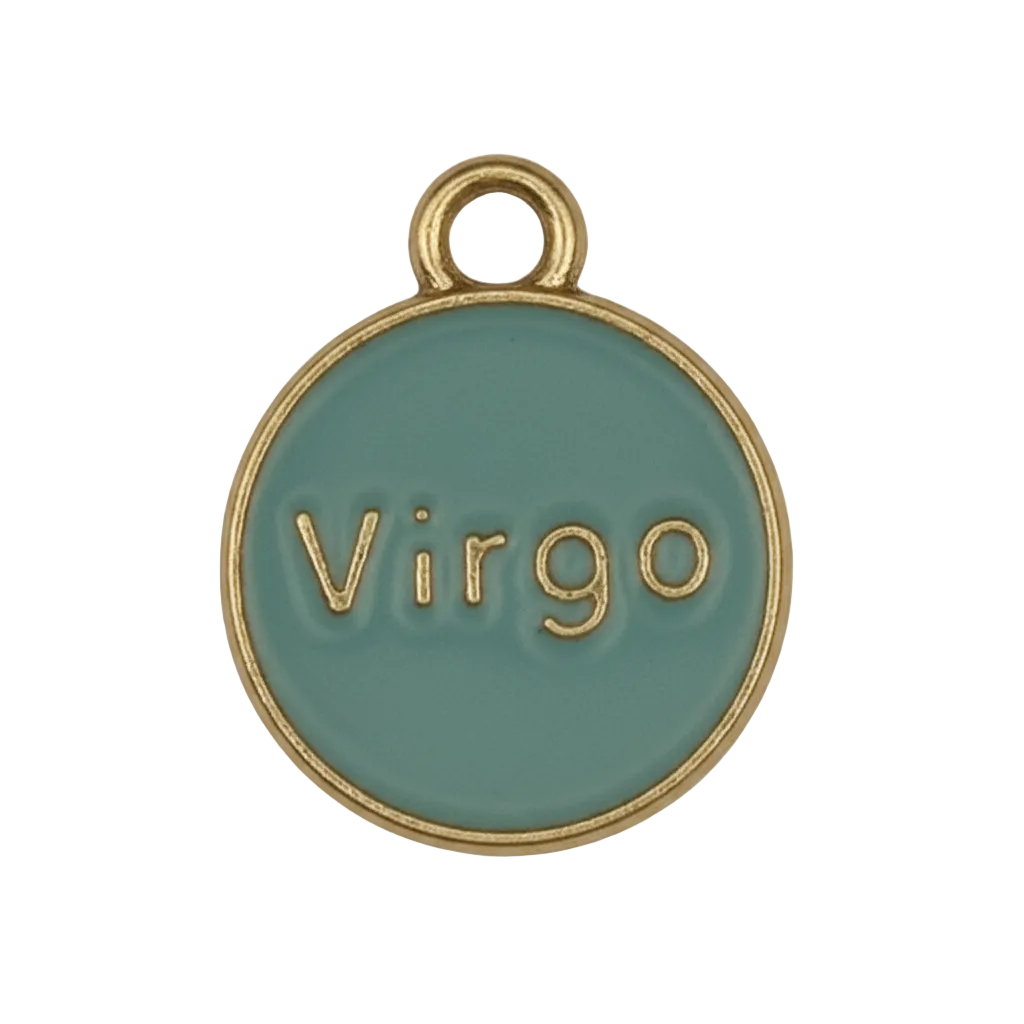 close-up of round teal Virgo charm with gold-tone rim on black background