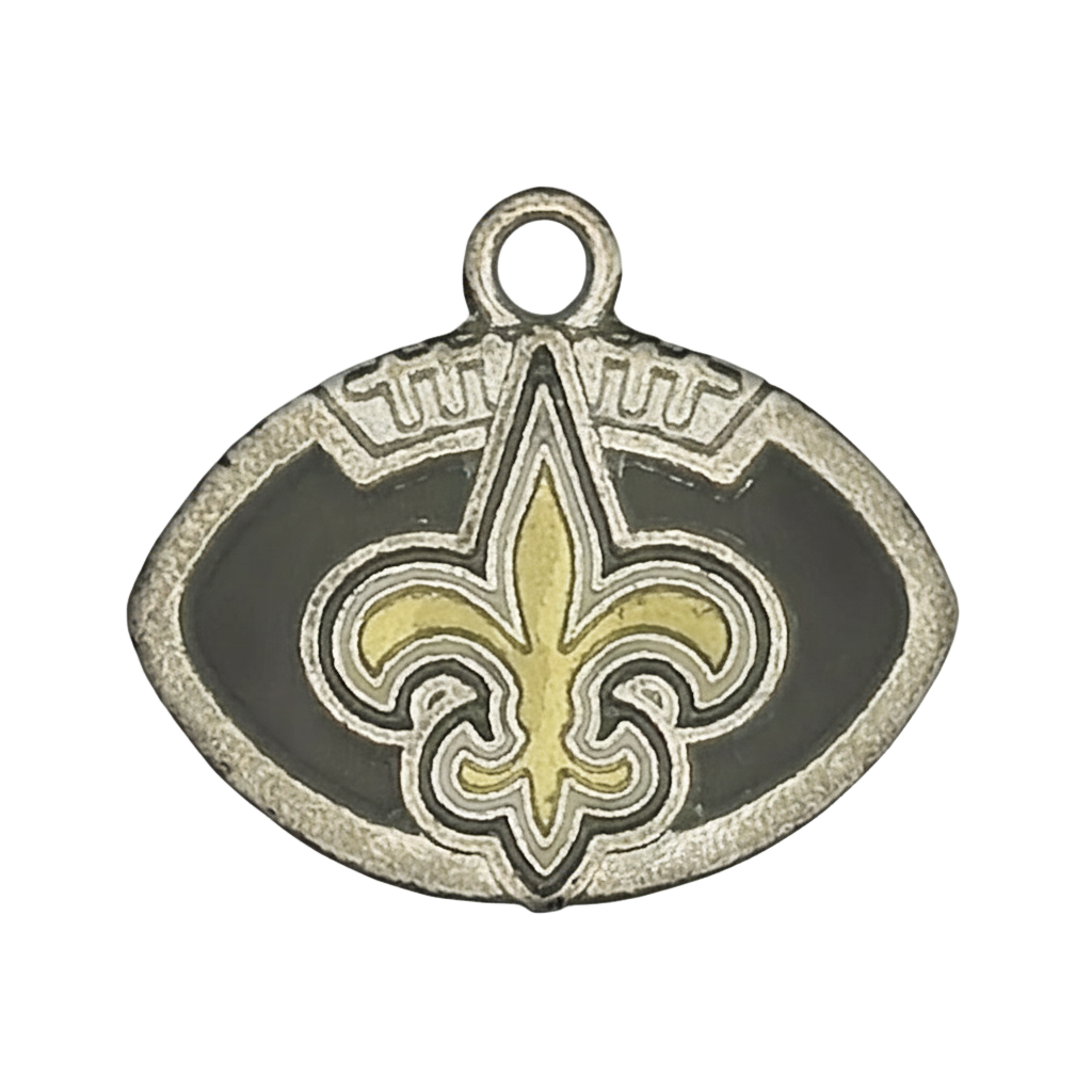 close-up of silver football-shaped charm with black enamel and a gold fleur-de-lis