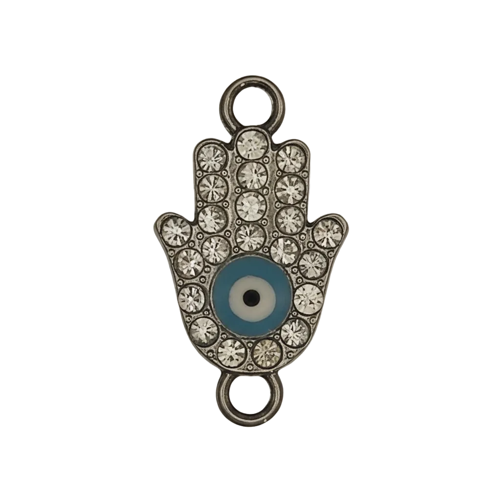close-up of silver-tone hamsa hand charm with clear rhinestones and blue evil eye center on black background