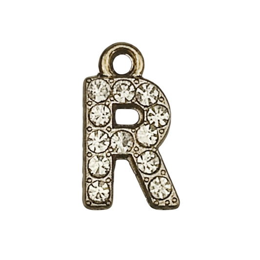 close-up of gold-tone rhinestone letter R charm