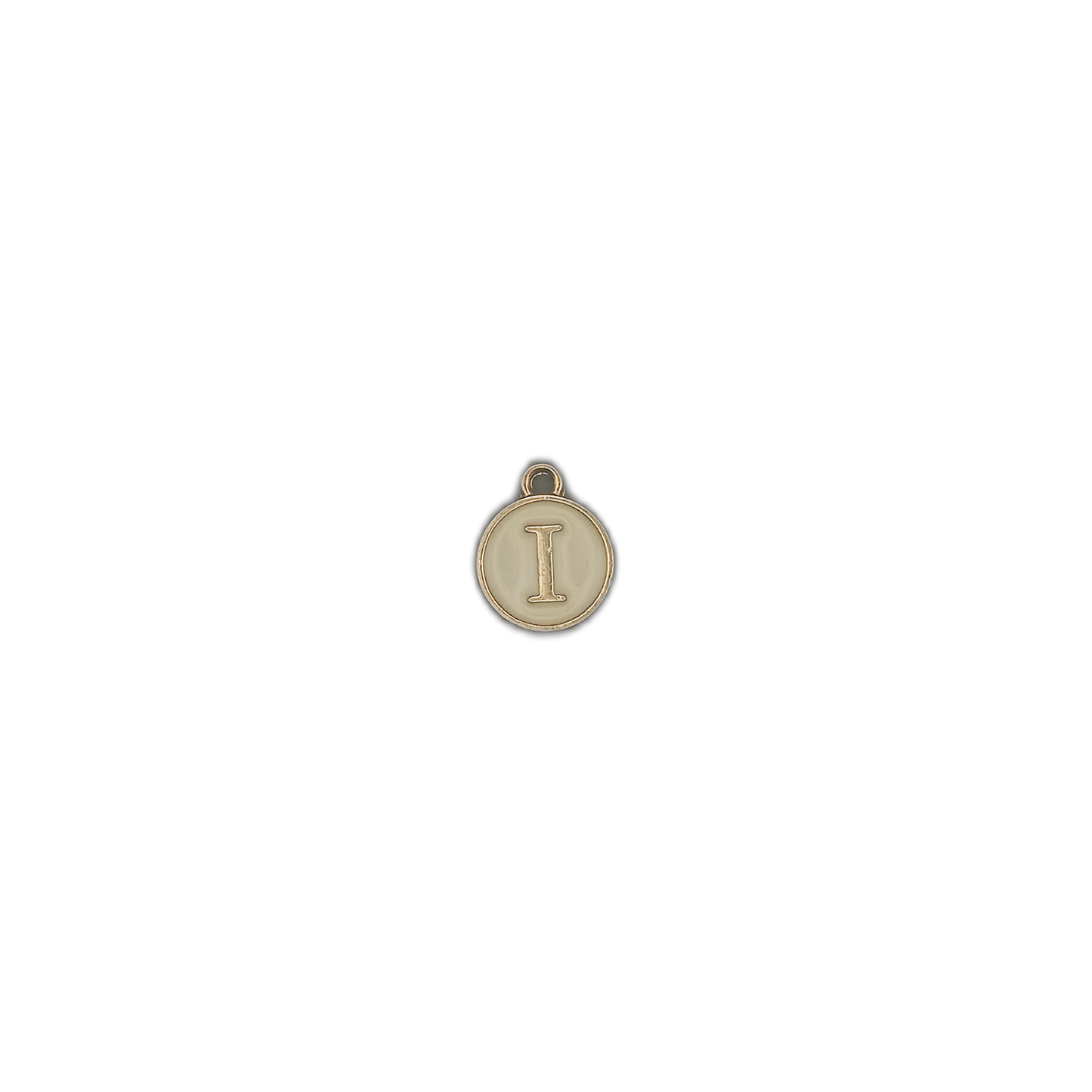 Small round letter I charm with cream center on a black background.