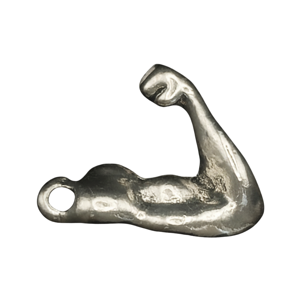 close-up of silver-tone flexed bicep arm charm on black background