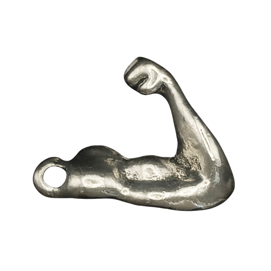 close-up of silver-tone flexed bicep arm charm on black background