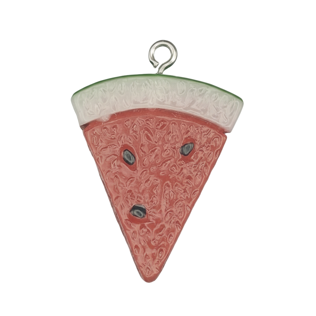 close-up of a watermelon slice enamel charm on a black background