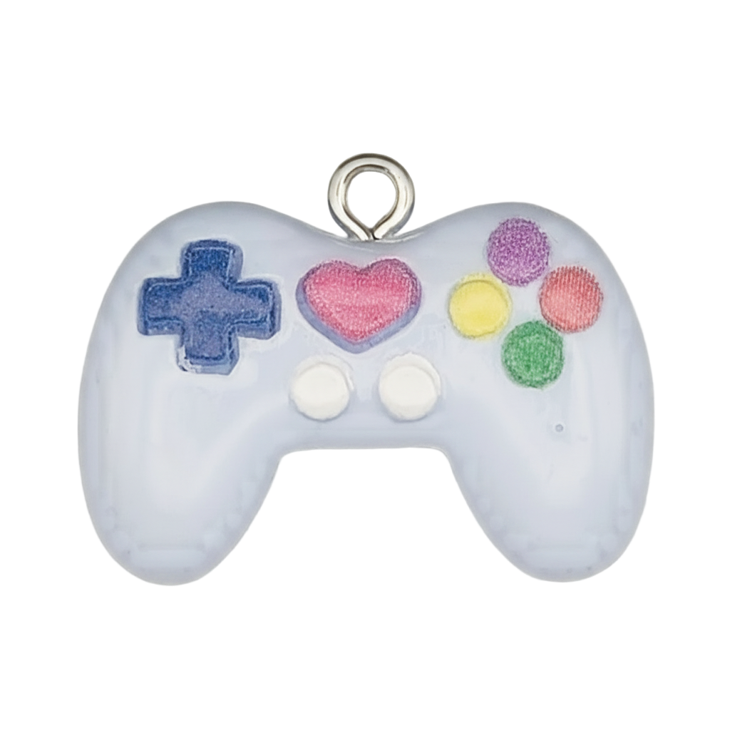close-up of white game controller charm with colorful buttons
