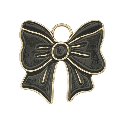 black bow charm with gold outline on black background