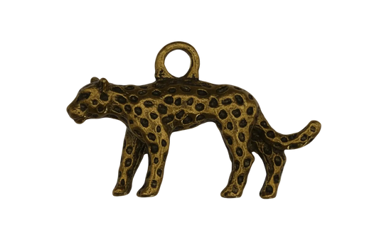 close-up of small gold spotted leopard charm on black background