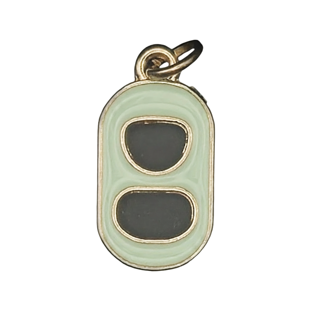 close-up of mint and black enamel soda can tab charm with gold edges