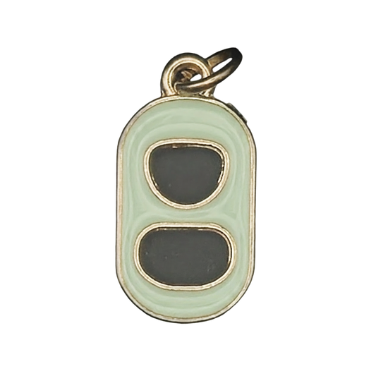close-up of mint and black enamel soda can tab charm with gold edges