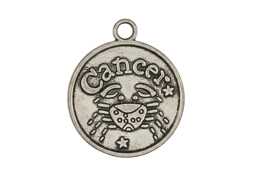 Close-up of round silver-tone Cancer zodiac charm with crab design on black background.