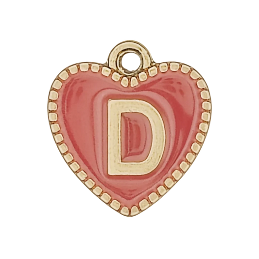close-up of red heart-shaped charm with gold letter D
