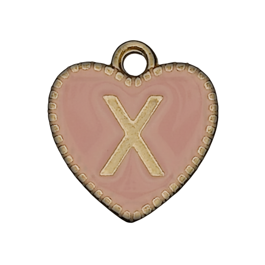 close-up of pink heart charm with gold X and dotted border
