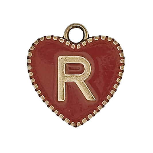 close-up red heart charm with gold letter R and dotted border
