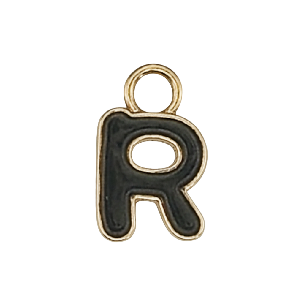 Close-up of a black enamel letter R charm with a gold outline on a black background.