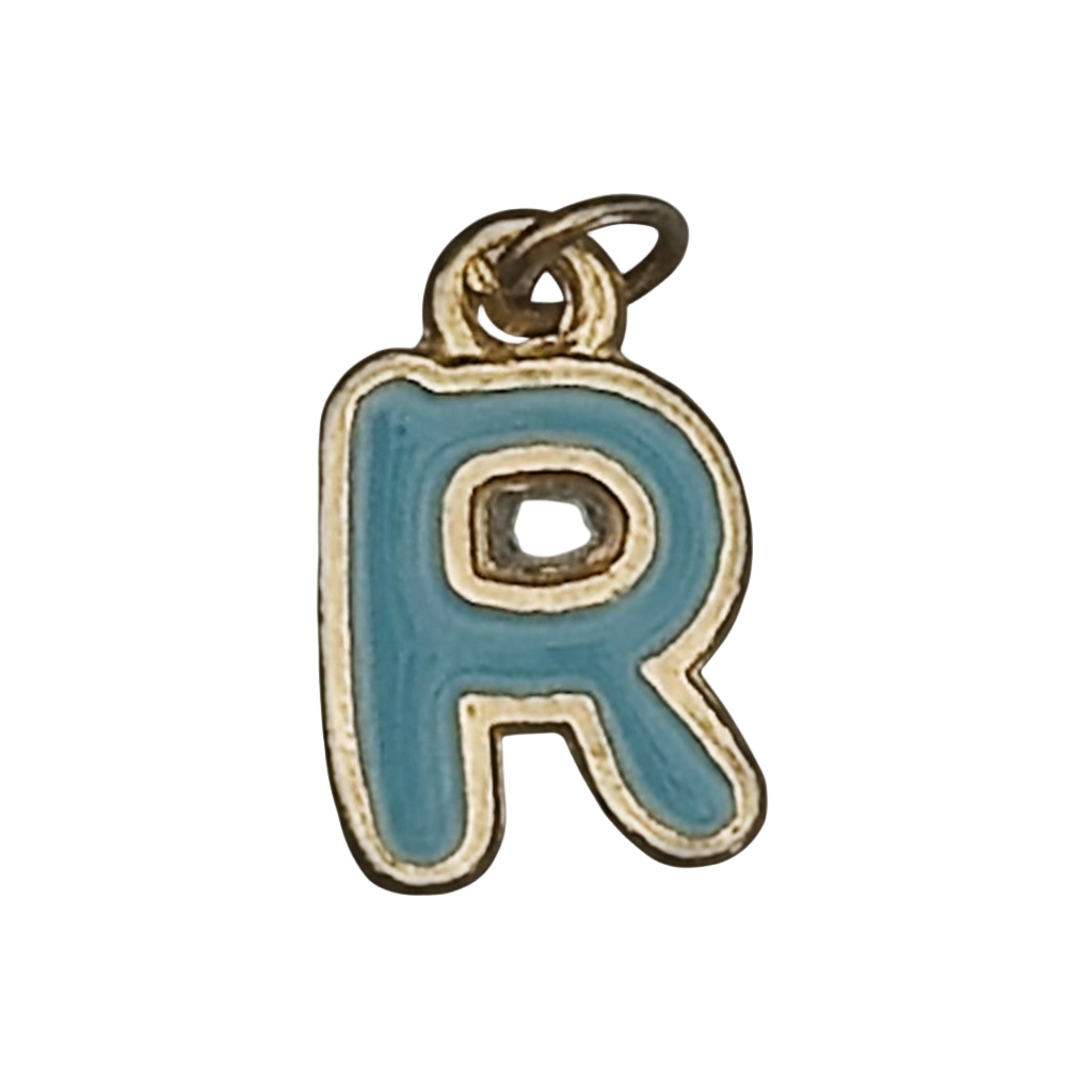Close-up of a blue enamel letter R charm with a gold outline on a black background.