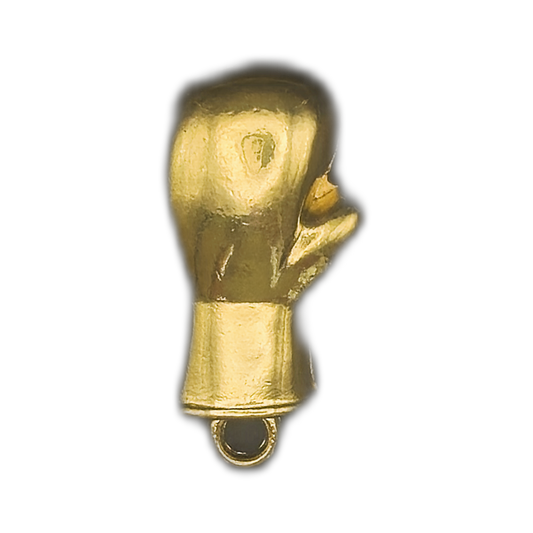 close-up of small gold boxing glove charm on black background
