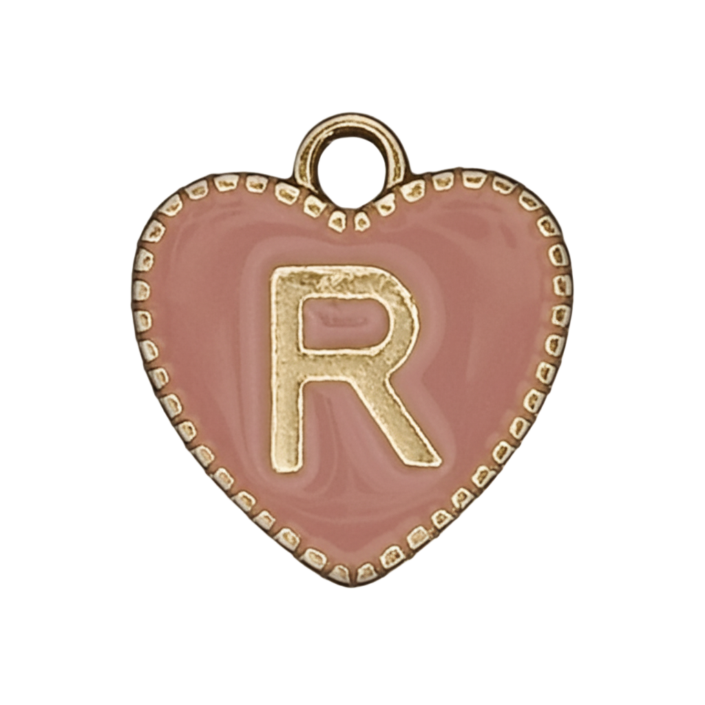 close-up of pink heart charm with gold letter R